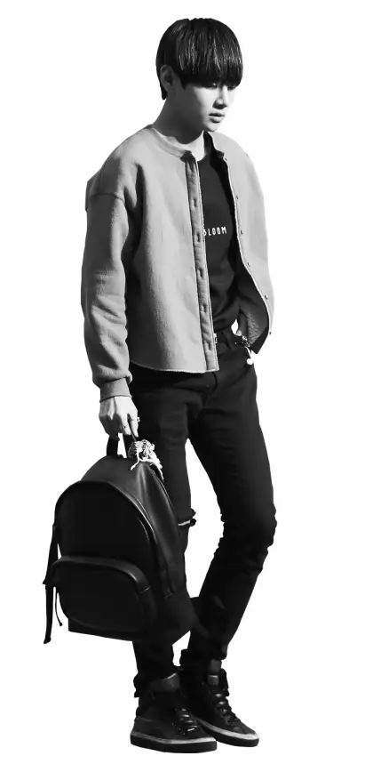 Person Holding Backpack in Casual Outfit