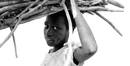 Woman Carrying Wood in Black and White