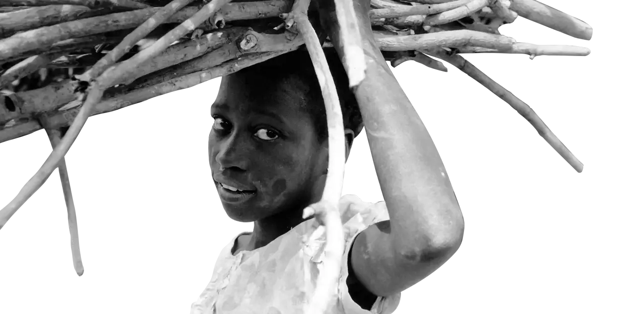 Woman Carrying Wood in Black and White