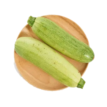 Fresh Green Zucchini on Wooden Plate