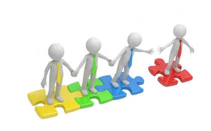 Teamwork Concept with Puzzle Pieces and Figures
