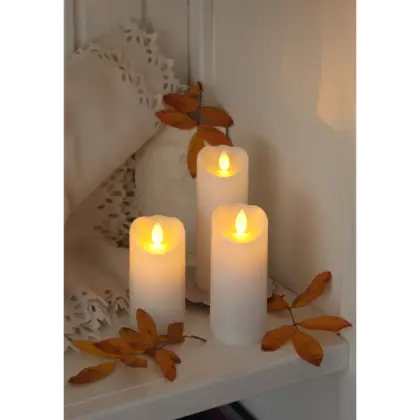 Glowing Candles with Autumn Leaves