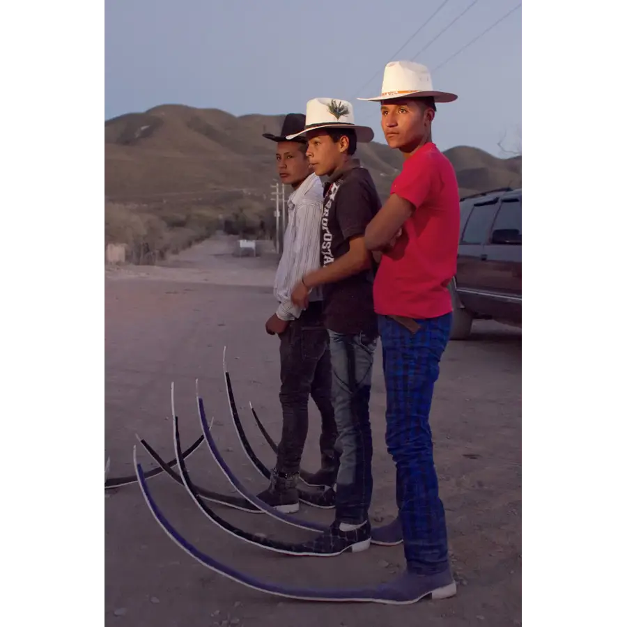 Men with Long Shoes and Cowboy Hats