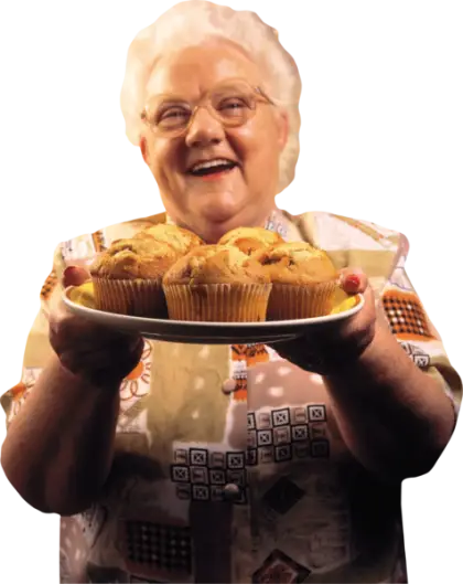 Woman offering a plate of muffins