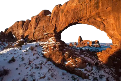 Natural Rock Arch in a Snowy Desert