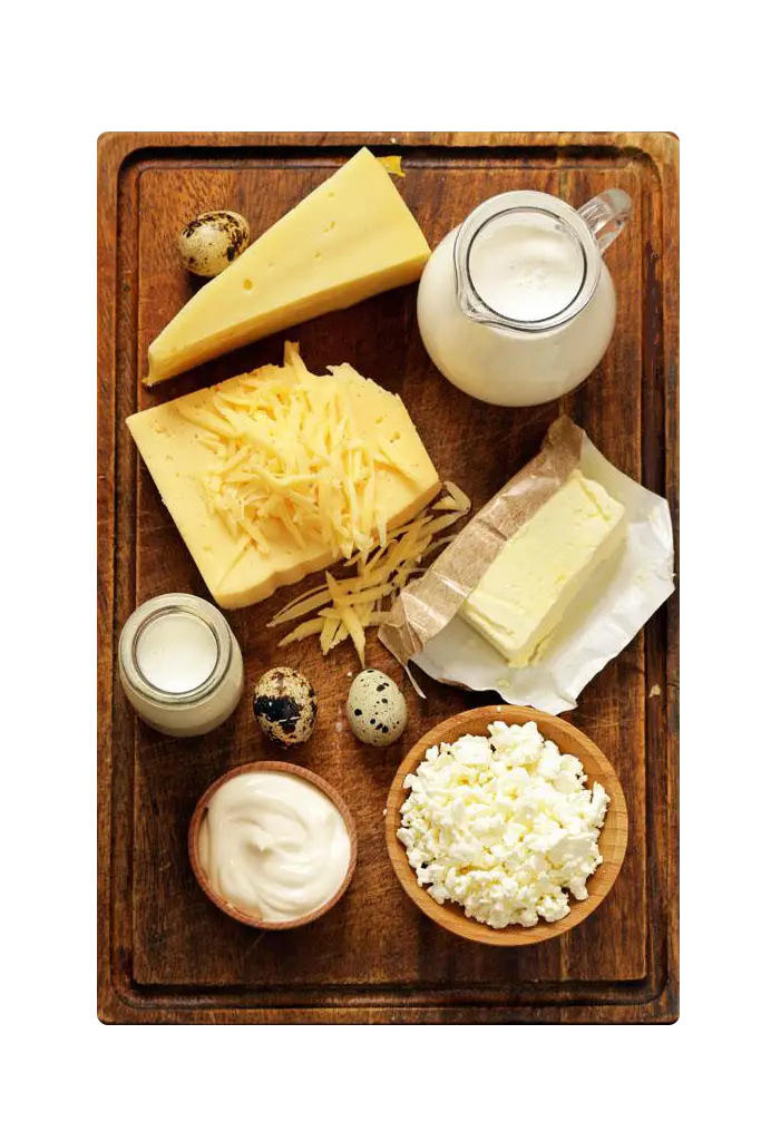 Assorted Dairy Products on Wooden Board