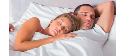 Sleeping Couple in Bed