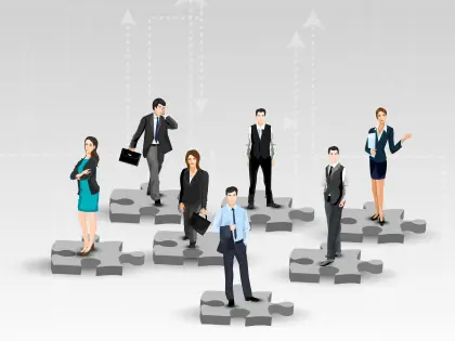 Business Team Standing on Puzzle Pieces
