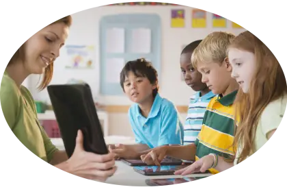 Teacher Using Tablet with Students in Classroom