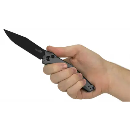 Hand Holding a Folding Knife with Black Blade