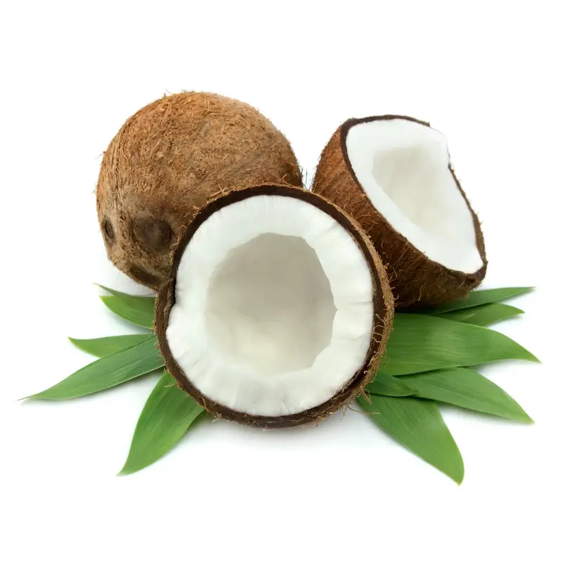 Whole and Halved Coconuts on Leaves