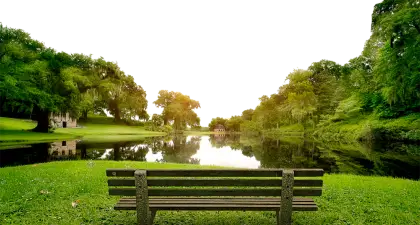 Park Bench by the Lake at Sunset