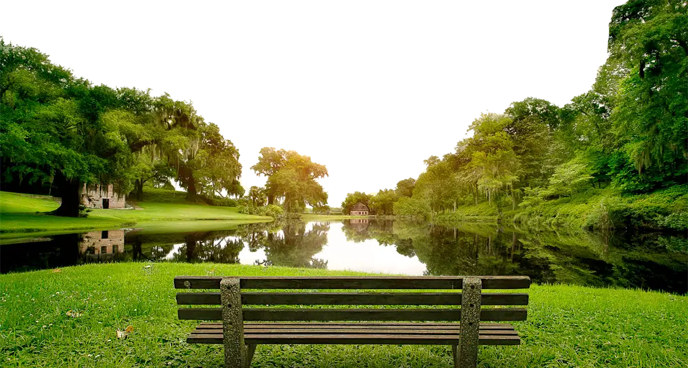 Park Bench by the Lake at Sunset