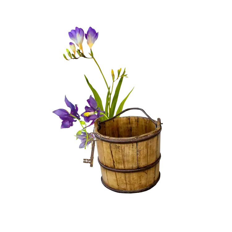 Purple Flowers in Wooden Bucket