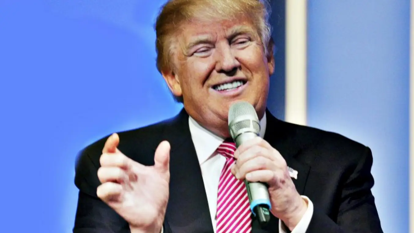 Man Speaking with Microphone in Formal Setting