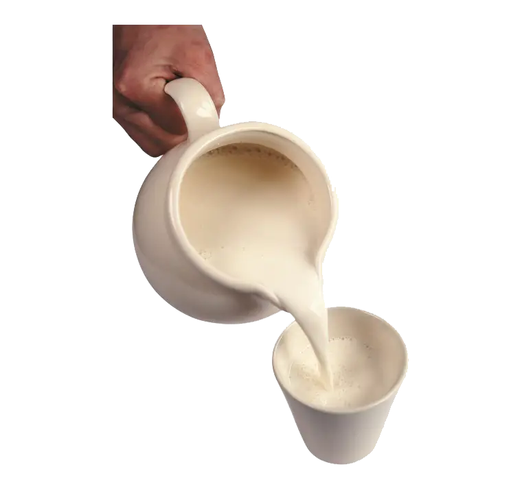Pouring Fresh Milk into a Cup