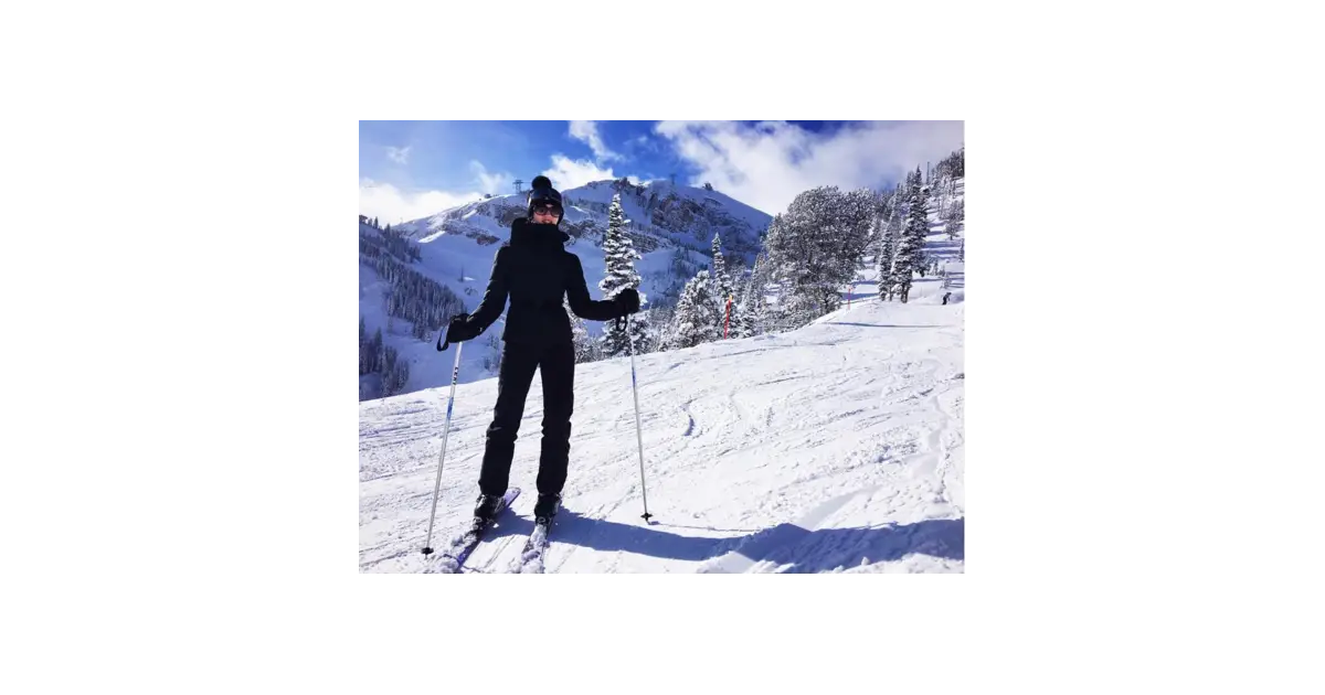 Person Skiing in Snowy Mountains