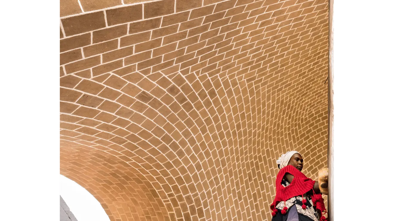 People Under Brick Arch