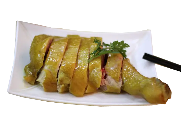 Sliced Chicken on Plate with Herbs