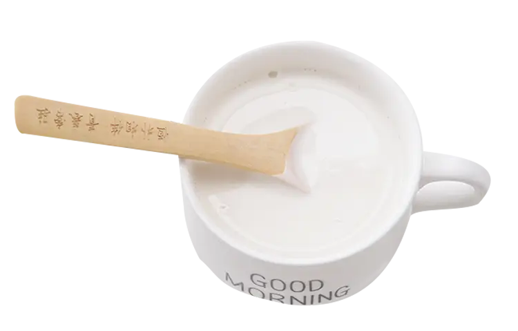 Cup of Milk with Wooden Spoon
