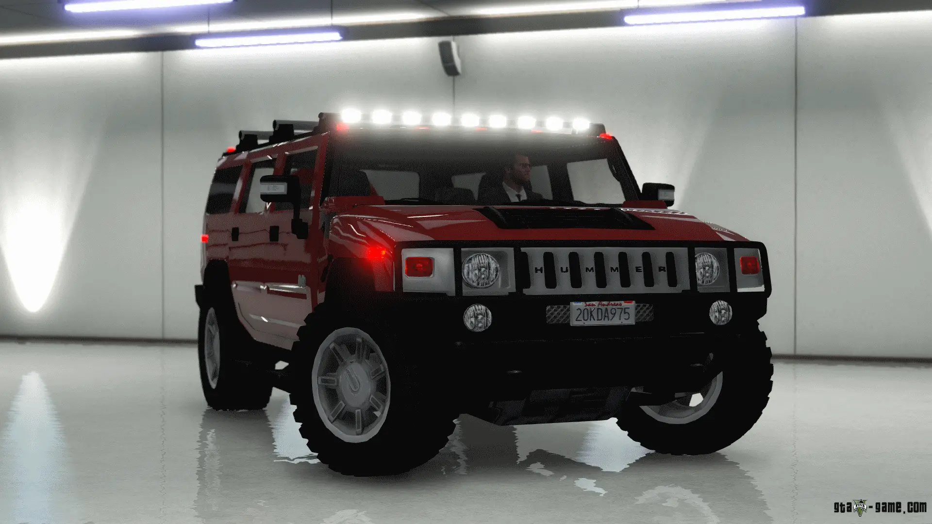 Red SUV in a Garage with Headlights On