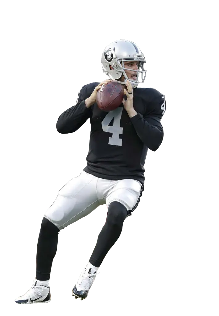 American Football Player Holding Ball During Game