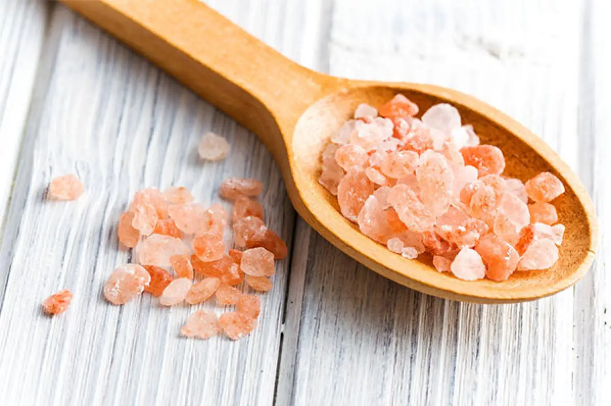 Pink Salt Crystals in Wooden Spoon