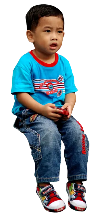 Child in Blue Shirt and Jeans Sitting