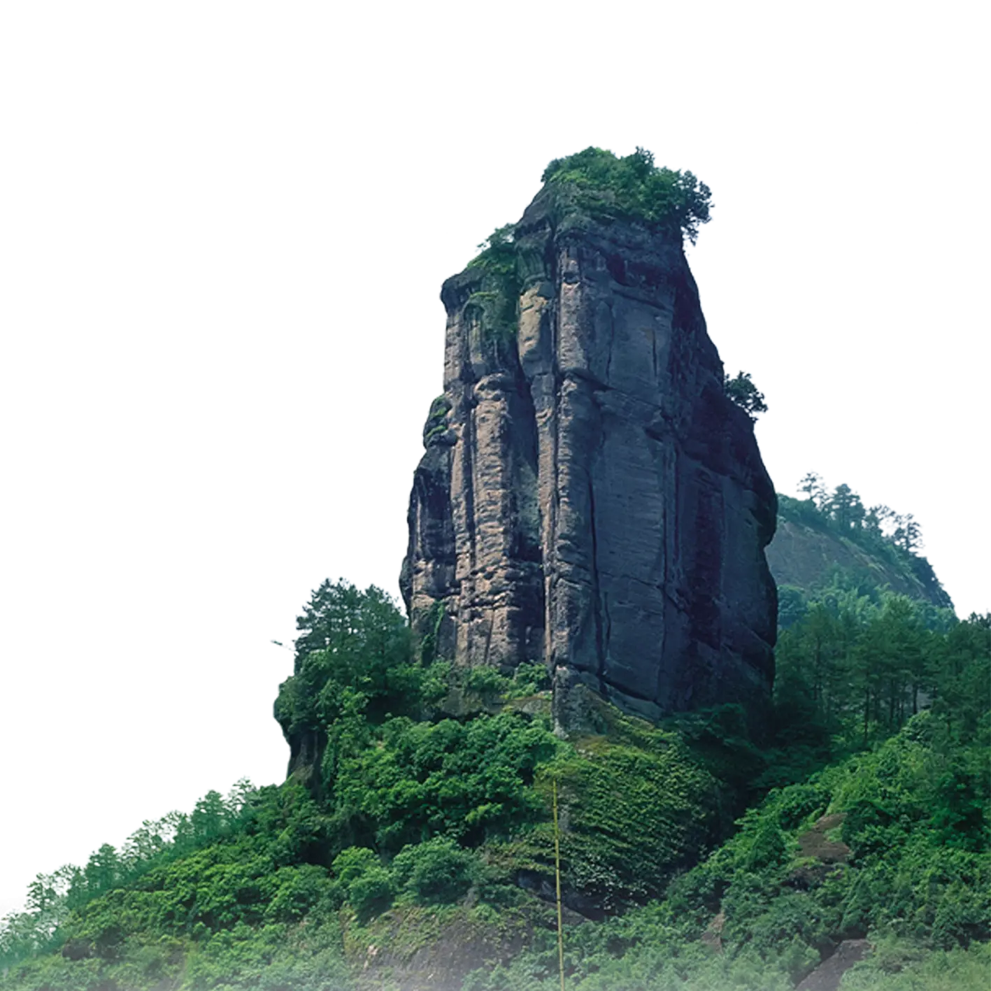 Tall Rock Formation with Greenery