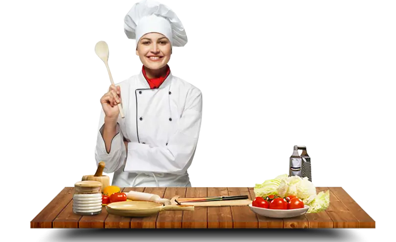 Smiling Chef with Cooking Ingredients in Kitchen