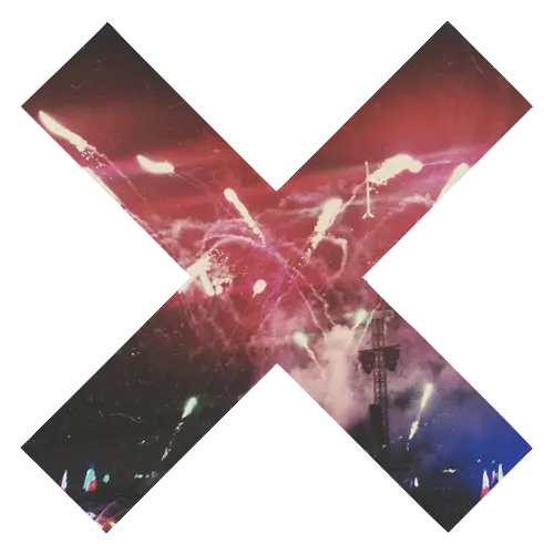 X Symbol with Fireworks in the Night Sky