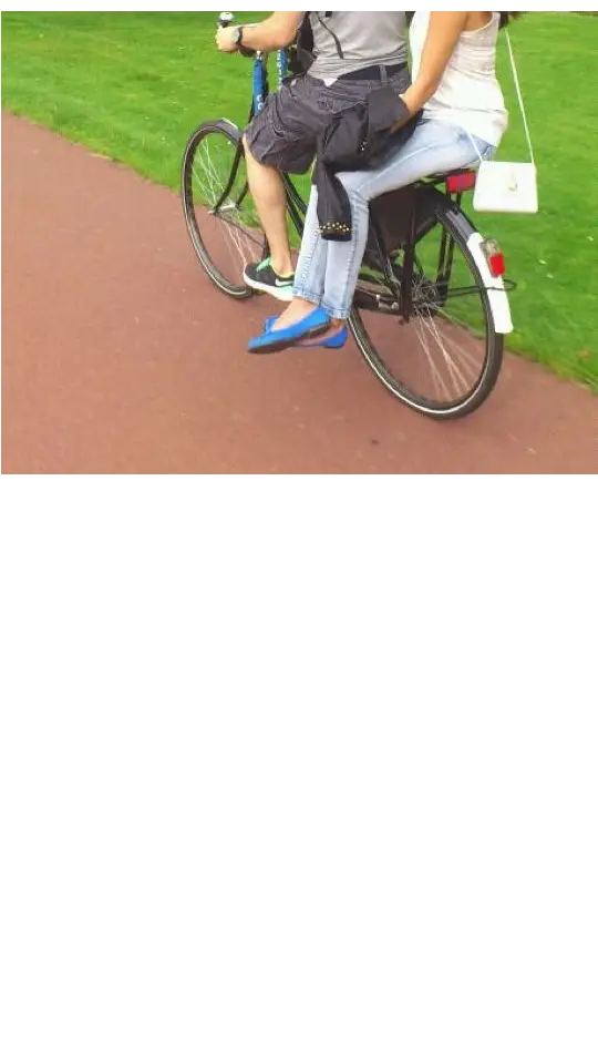 Couple Riding Bicycle in Park