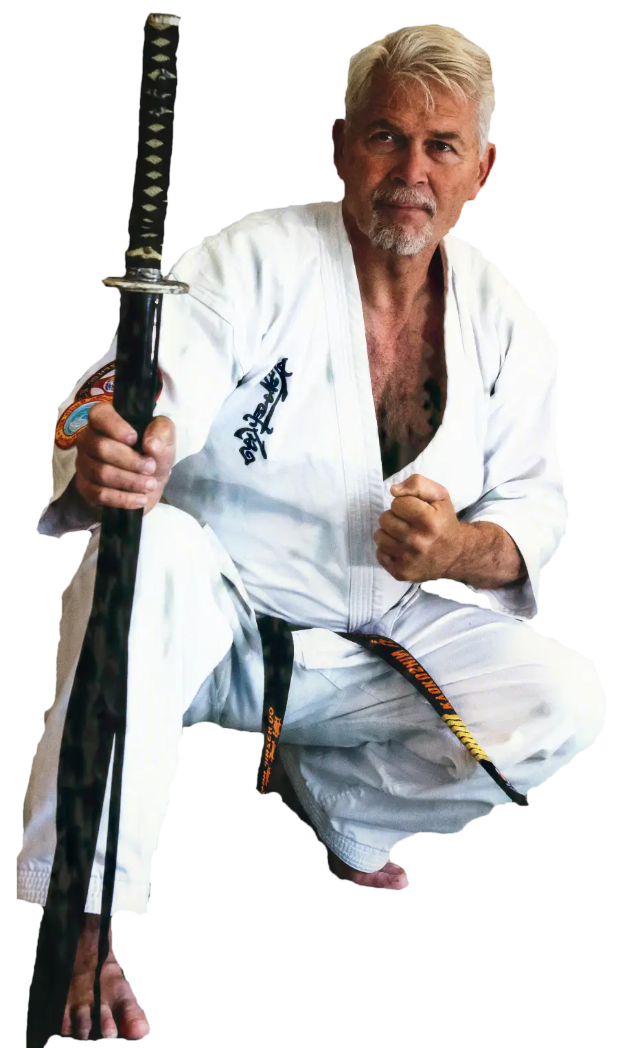 Man in Martial Arts Attire With Sword