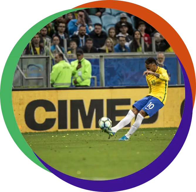 Soccer Player Kicking Ball in Stadium