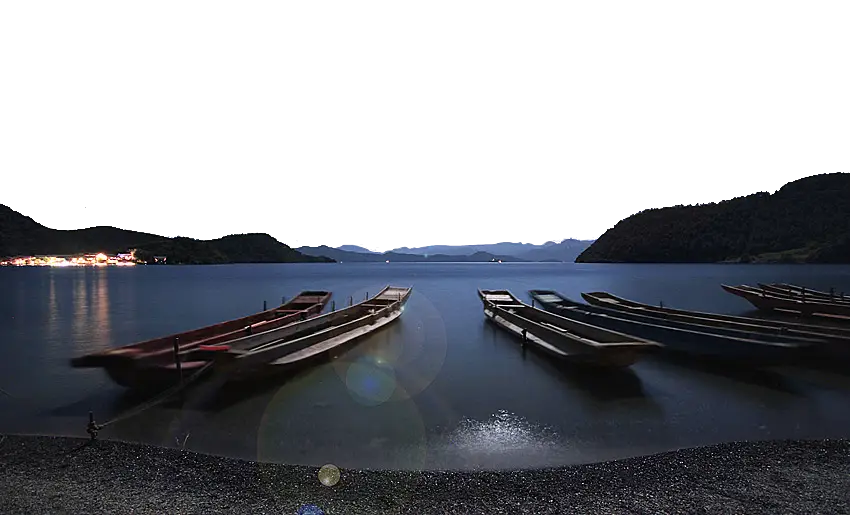 Serene Boats on a Lake at Dusk