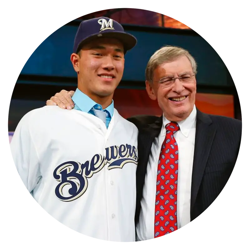 Two People Smiling in Brewers Uniform