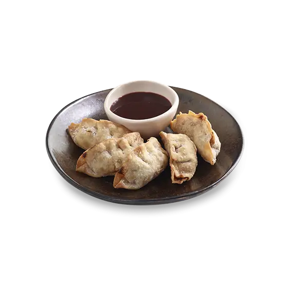 Plate of Dumplings with Sauce